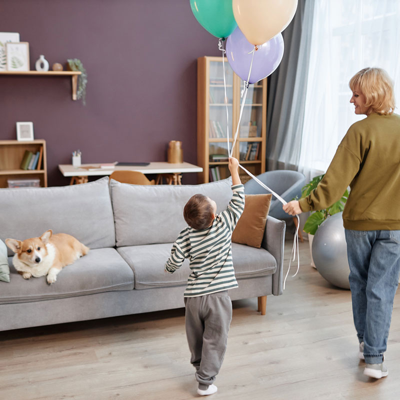 The Collaborative Problem Solving (CPS) Approach, mother and son with balloons facing away from the camera