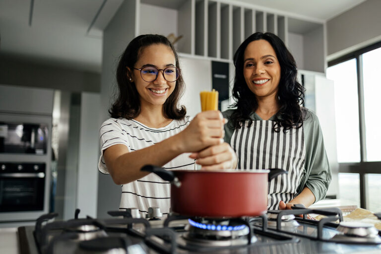 Five Ways to Connect with Your Teen, mother and teenage daughter cooking pasta together