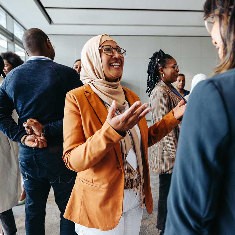 Corporate Counseling with Mirjam Quinn, diverse group of coworkers at a networking event