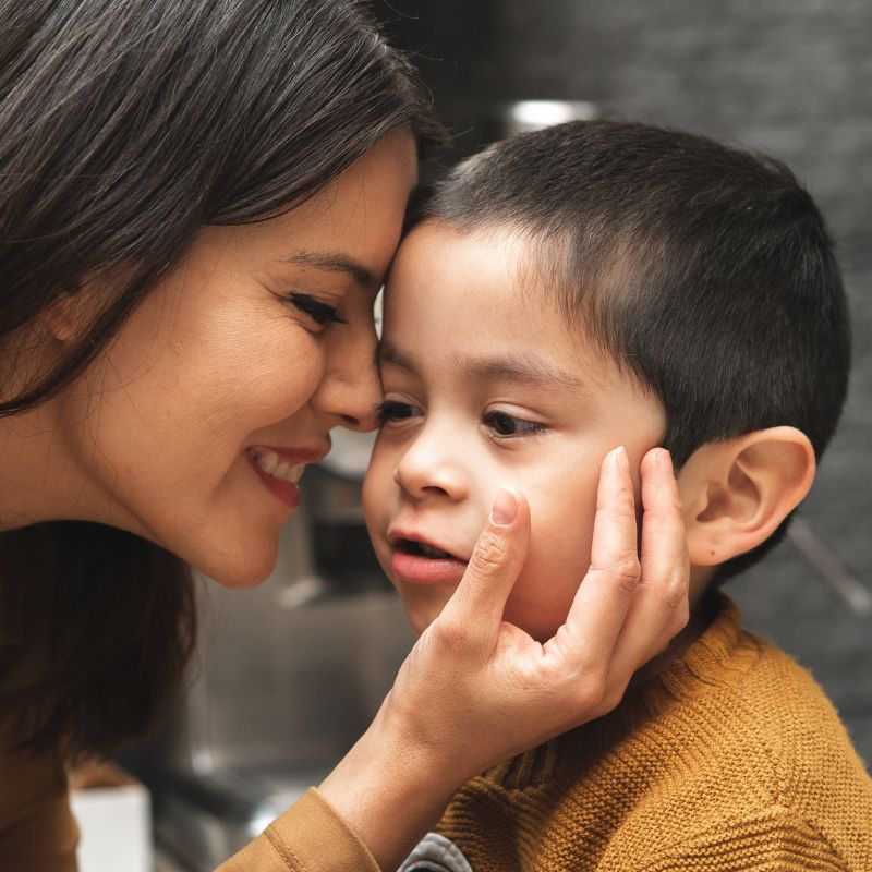 MQA EarliPoint Autism Assessment, mother with a young boy holding his face in her hands