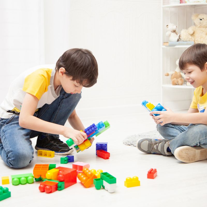 Mirjam Quinn Autism Screening, two boys playing with blocks together